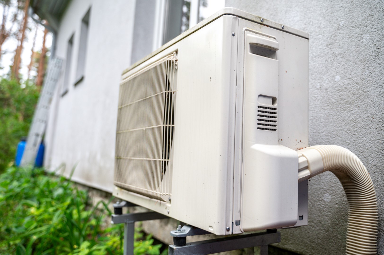air conditioning unit outside house with greenery 2026 03 24 09 04 54 utc Large