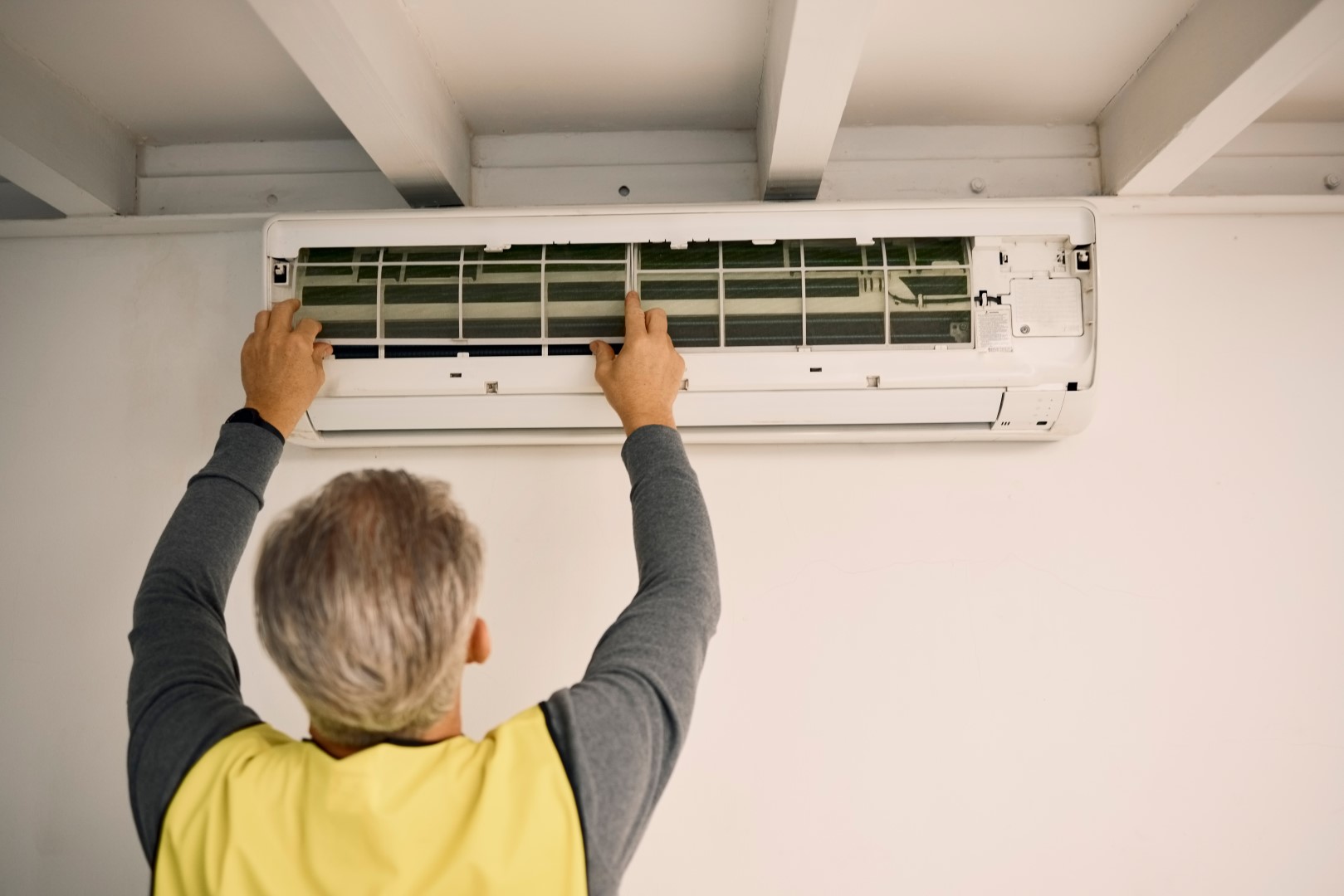 maintenance man inspecting air conditioner unit in 2026 03 25 02 15 52 utc Large