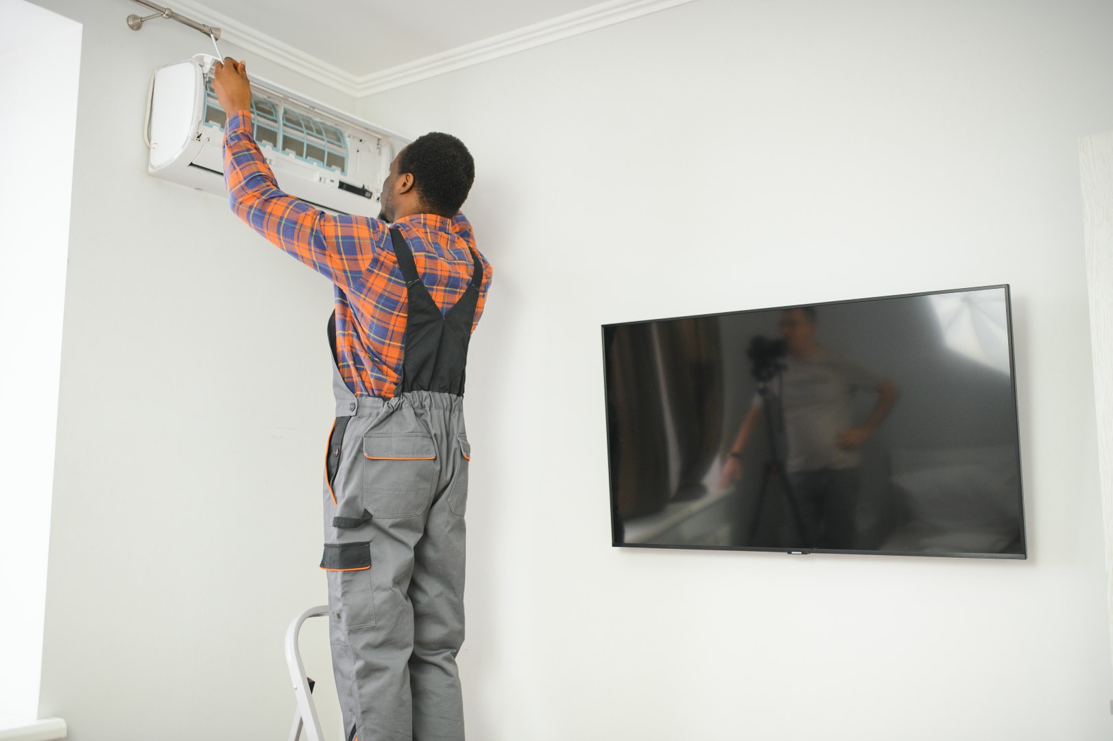 technician repairing air conditioning unit in a ho 2026 03 24 04 20 24 utc Large